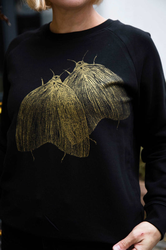 Schwarzer Pullover, Motten in glitzergoldener Farbe, 300g Bio-Baumwolle